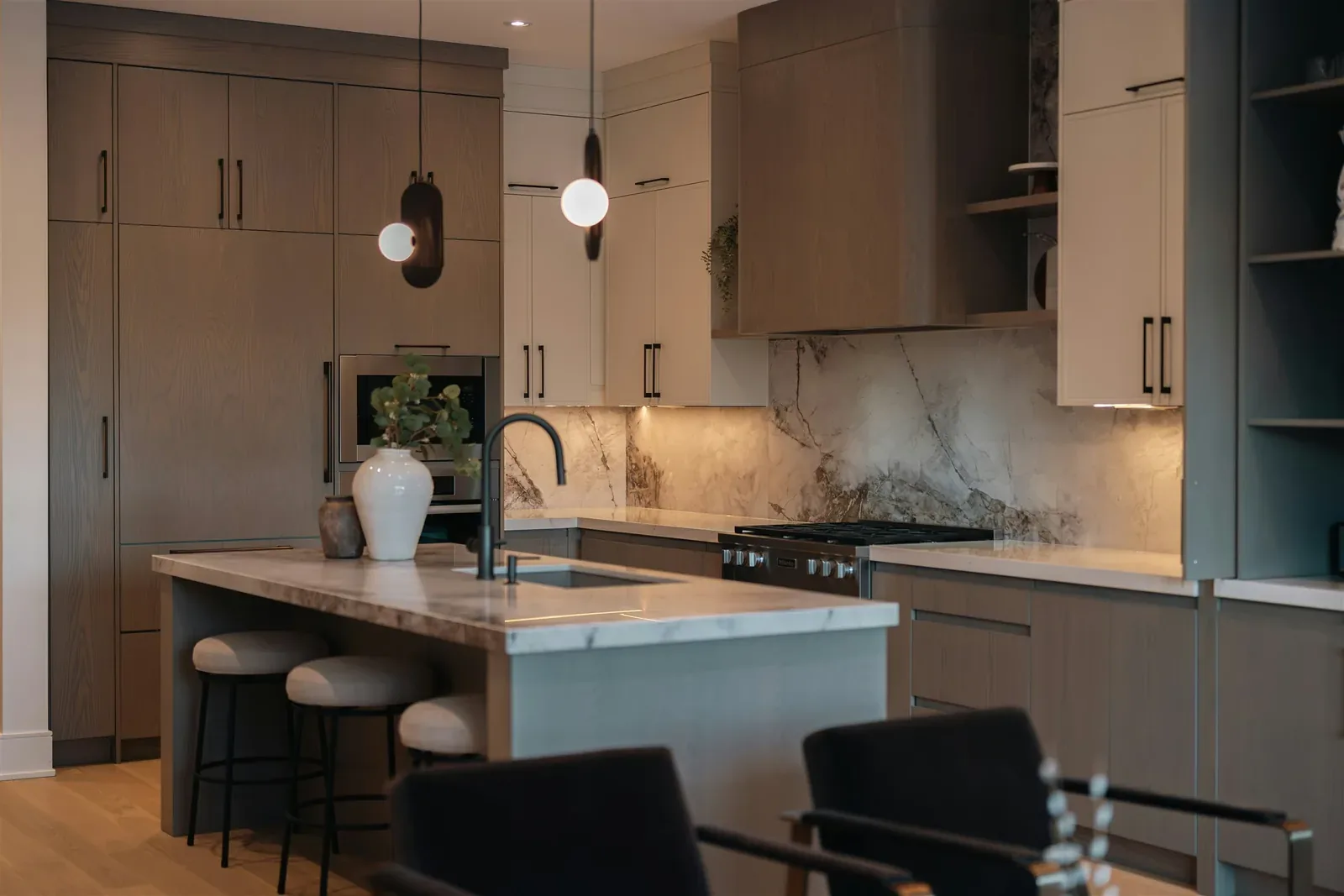 Finished kitchen with a stone countertop, island, and backsplash